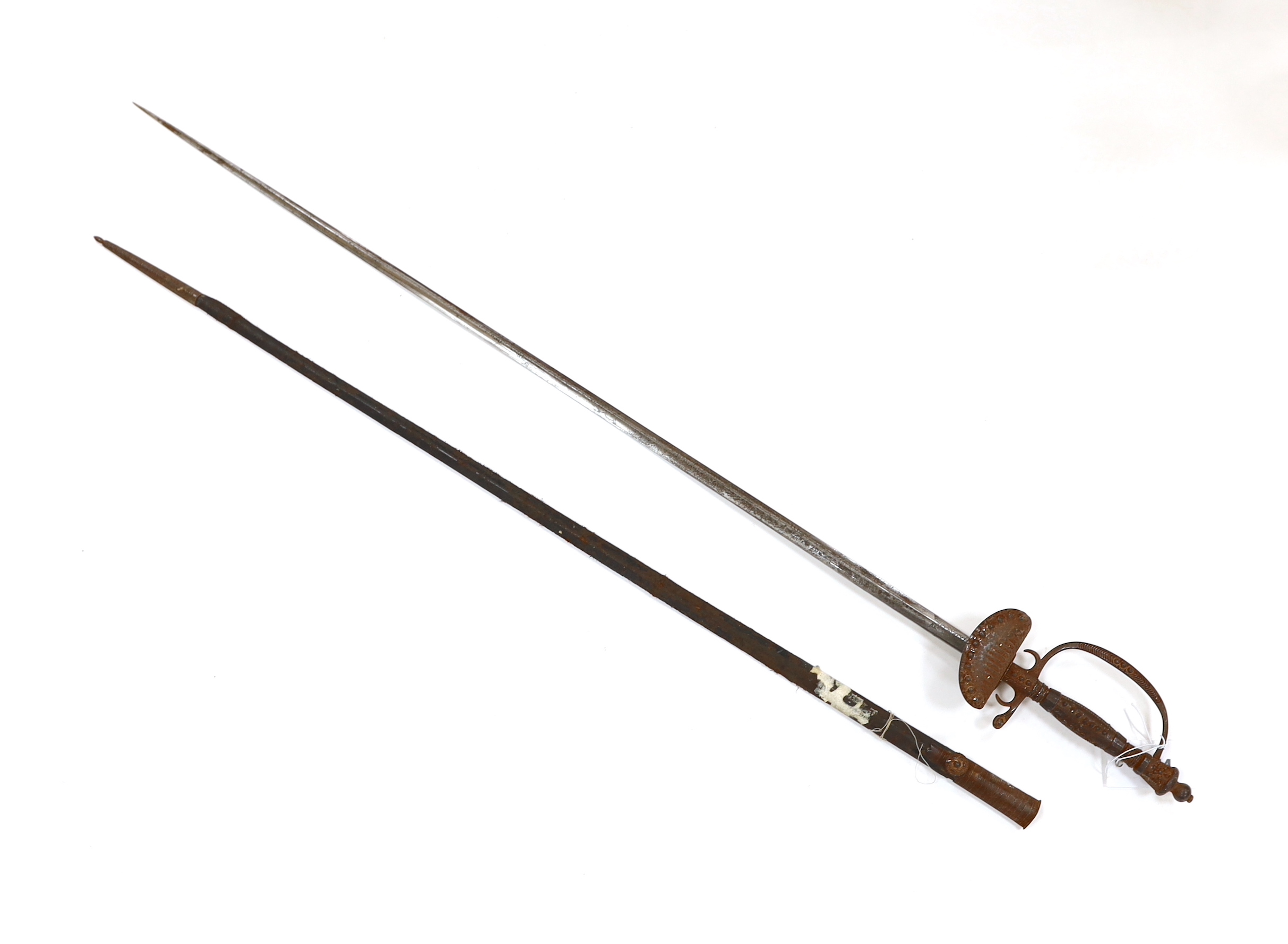 An English cut steel hilted dress court sword, c.1900, polished blade etched at forte, iron hilt slightly rusted, in its leather scabbard, blade 79cm